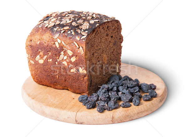 Unleavened bread with seeds on wooden board with raisins Stock photo © Cipariss