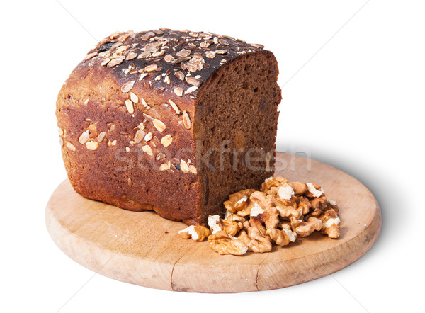 Unleavened bread with seeds on wooden board with nuts Stock photo © Cipariss