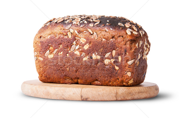 Unleavened bread with seeds and dried fruit on wooden board Stock photo © Cipariss