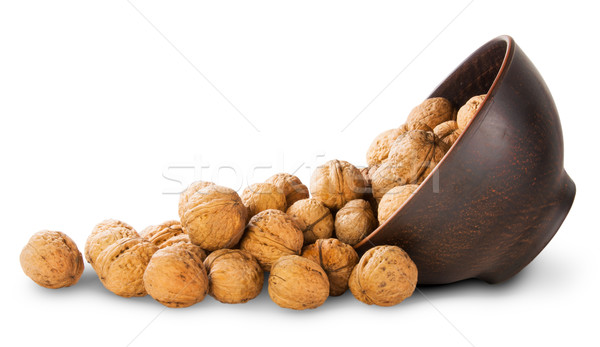 Walnuts Spill Out Of A Clay Bowl Stock photo © Cipariss