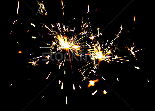 Two bright festive New Year Christmas sparklers Stock photo © Cipariss