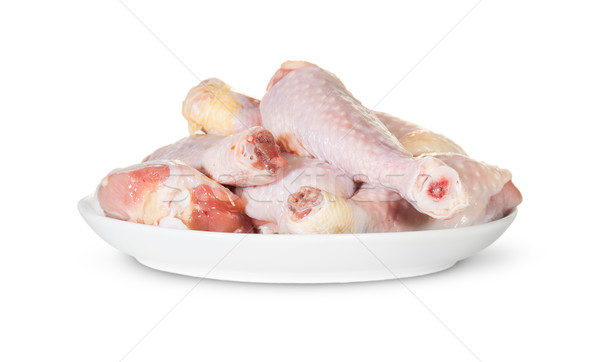 Surowy kurczaka nogi biały tablicy odizolowany Zdjęcia stock © Cipariss