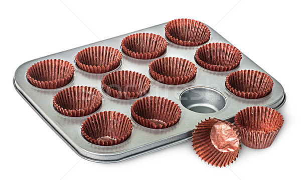 Cupcake and muffin pan with paper cups some beside Stock photo © Cipariss