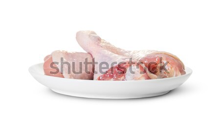 Trzy surowy kurczaka nogi biały tablicy Zdjęcia stock © Cipariss
