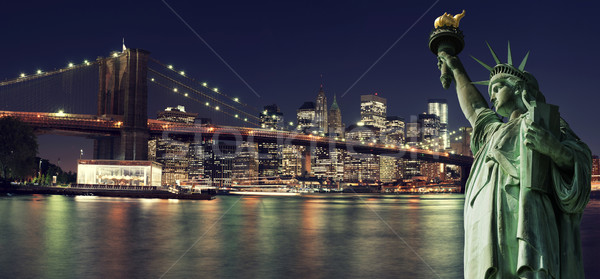 New York Skyline at night with Statue of Liberty Stock photo © cla78