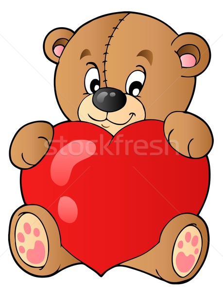Stock photo: Cute teddy bear holding heart
