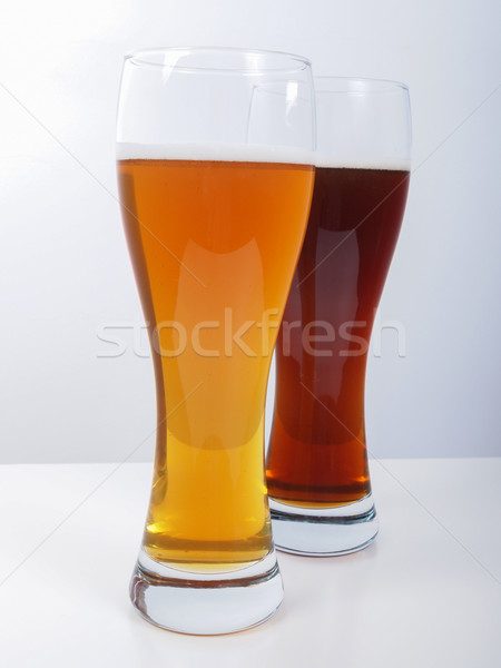 Kettő szemüveg sör sötét fehér Stock fotó © claudiodivizia