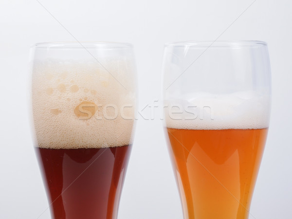 Kettő szemüveg sör sötét fehér Stock fotó © claudiodivizia