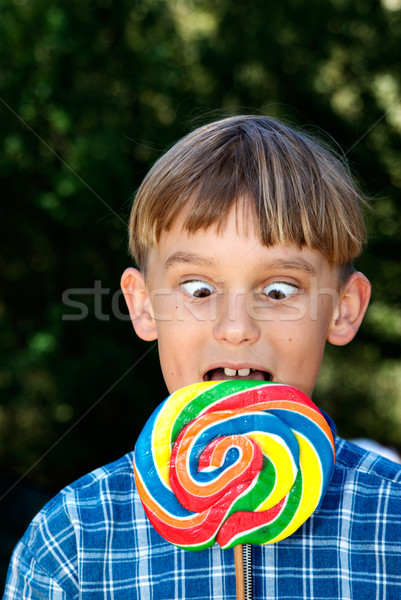 cross eyed boy eating lollipop Stock photo © clearviewstock