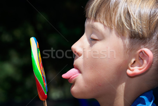 boy licking a lollipop Stock photo © clearviewstock