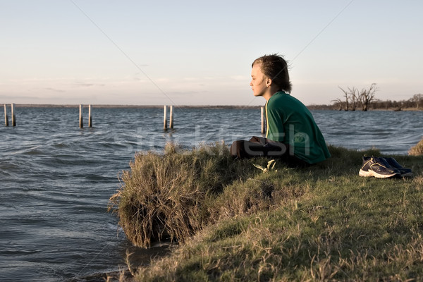 boy looking over lake Stock photo © clearviewstock