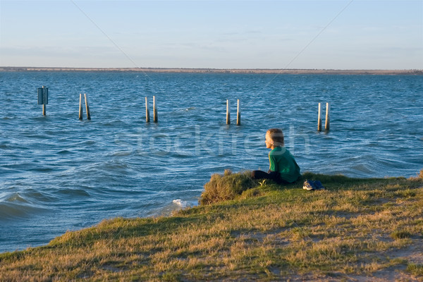 boy looking over lake Stock photo © clearviewstock
