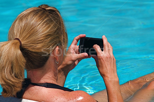 Piscine belle femme travail communications femme sourire [[stock_photo]] © cmcderm1