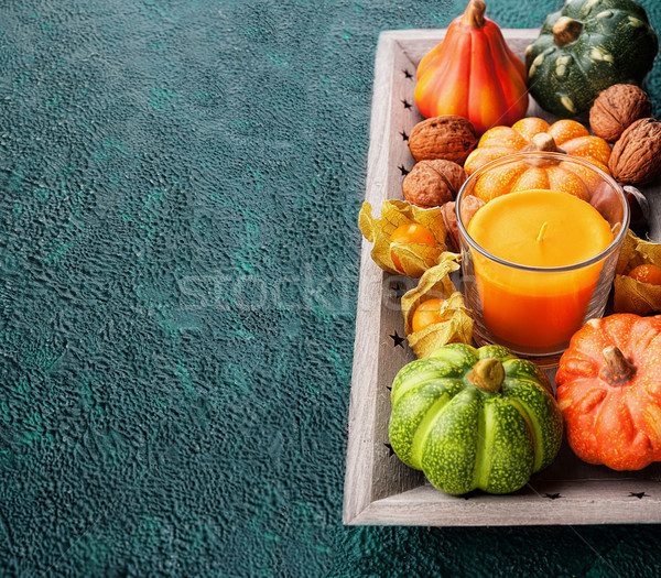 Stock photo: Tray with autumn harvest on textural background