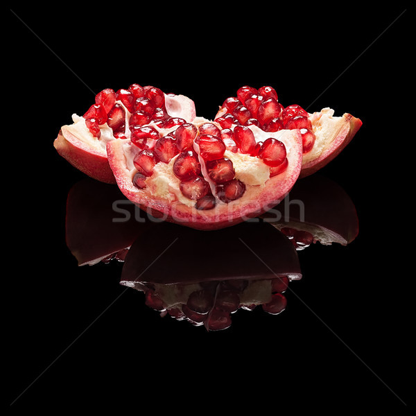 Part of pomegranate fruit with seeds Stock photo © Coffeechocolates