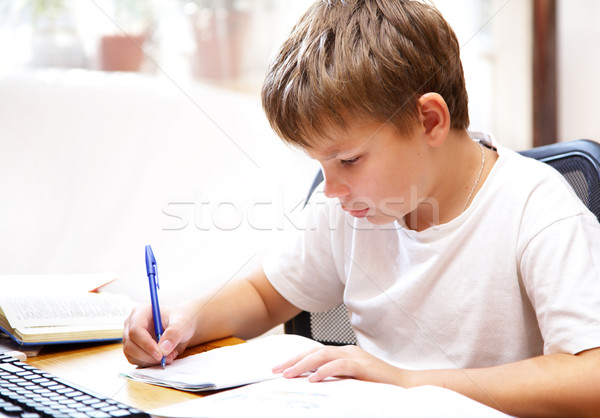 Fiú mögött asztal papír könyv iskola Stock fotó © cookelma
