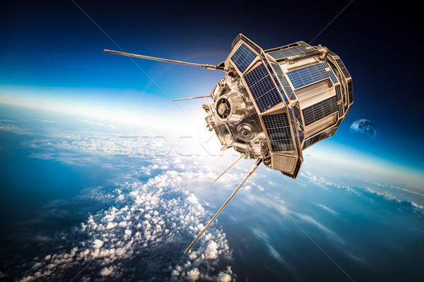 Space satellite over the planet earth Stock photo © cookelma