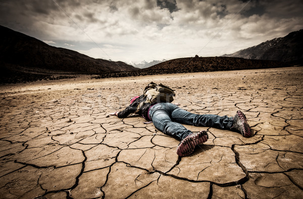 person lays on the dried ground Stock photo © cookelma
