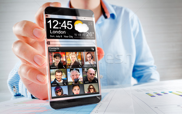 Foto d'archivio: Smartphone · trasparente · schermo · umani · mani · futuristico