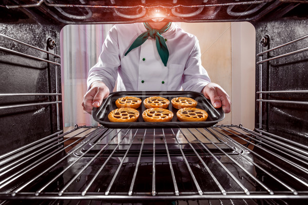 Chef cooking in the oven. Stock photo © cookelma