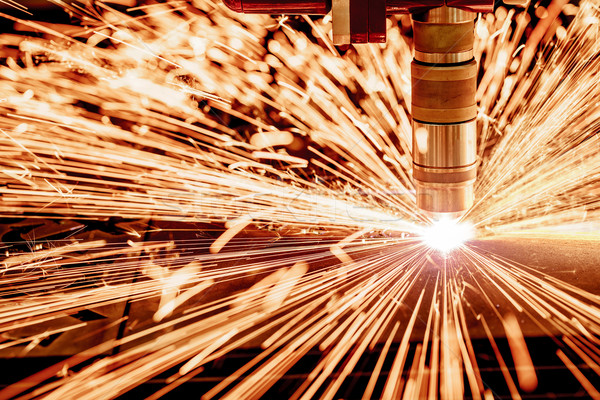 CNC Laser plasma cutting of metal, modern industrial technology. Stock photo © cookelma