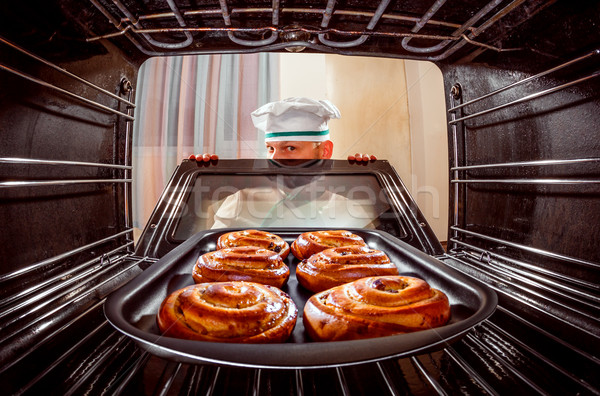 Chef cooking in the oven. Stock photo © cookelma