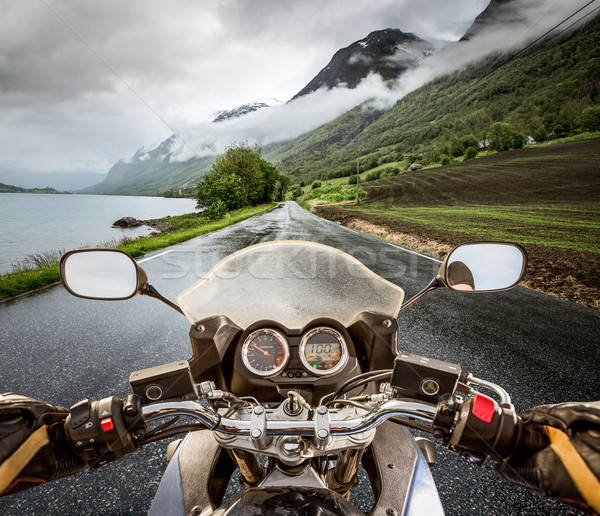 Ver motocicleta chuva sol pôr do sol Foto stock © cookelma