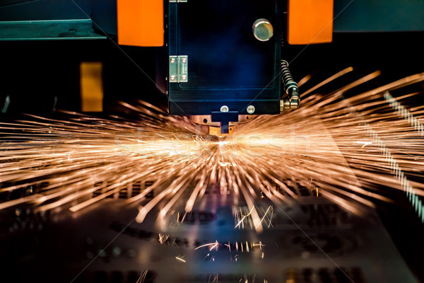 CNC Laser cutting of metal, modern industrial technology. Stock photo © cookelma