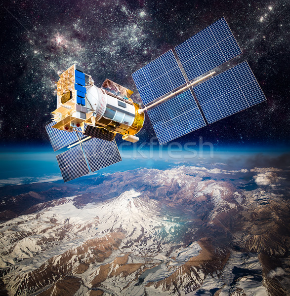 Space satellite over the planet earth Stock photo © cookelma