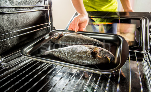 Cooking Dorado fish in the oven. Stock photo © cookelma