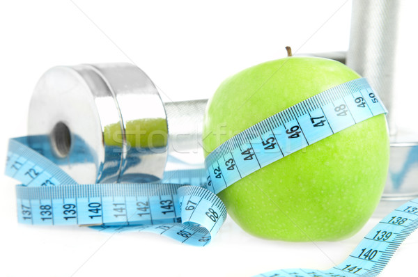 Dumbbells and apple. A healthy way of life Stock photo © cookelma