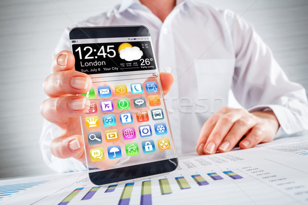 Smartphone transparent ecran uman mâini afişa Imagine de stoc © cookelma