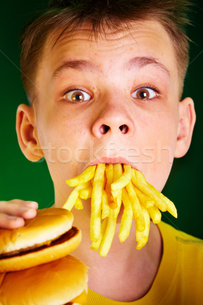 Stock photo: child and fast food.
