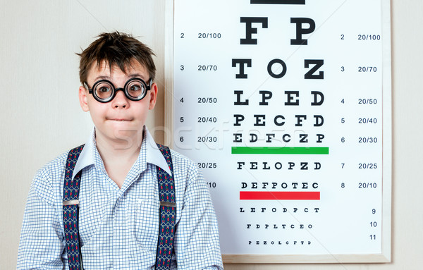 Stock photo: person wearing spectacles in an office at the doctor