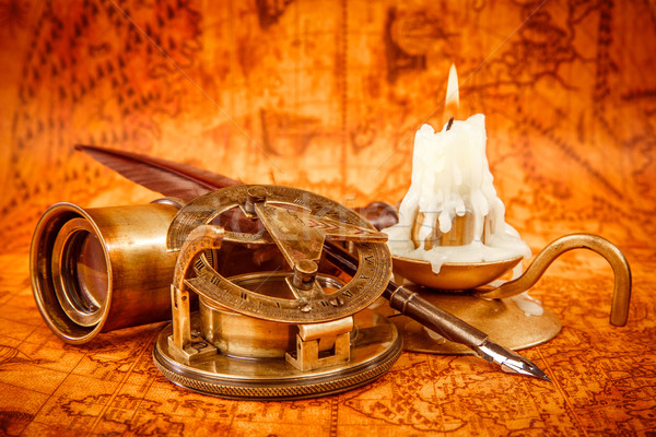 Vintage still life. Vintage items on ancient map. Stock photo © cookelma