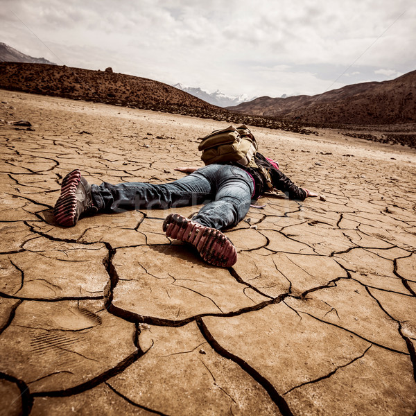 person lays on the dried ground Stock photo © cookelma