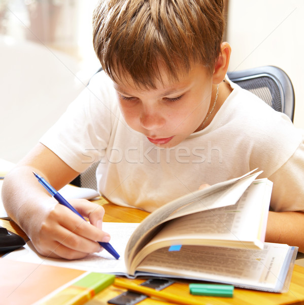 Сток-фото: мальчика · за · столе · бумаги · книга · школы