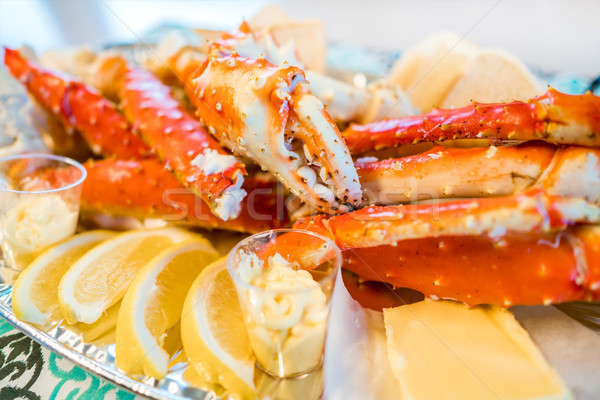 Red king crab legs with fresh lemon slices Stock photo © cookelma