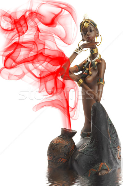 Figurine of the African girl on a white background Stock photo © cookelma