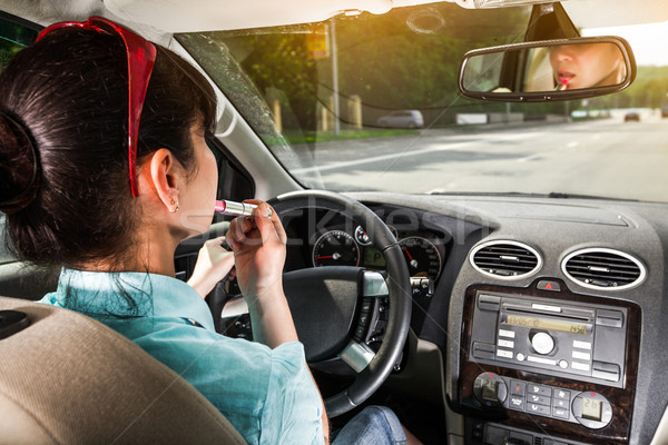 Conducción coche mujeres componen labios rueda Foto stock © cookelma