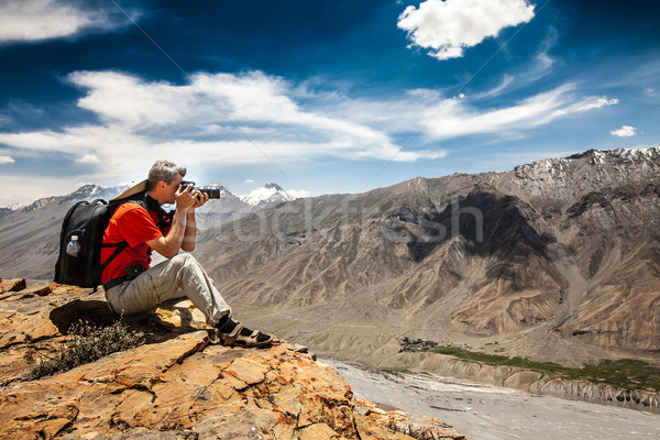 Photographer on the high mountain Stock photo © cookelma