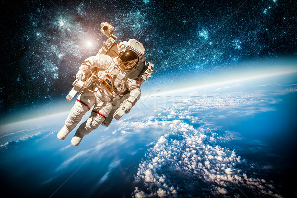 Astronauta przestrzeń kosmiczna tle planety Ziemi elementy obraz Zdjęcia stock © cookelma