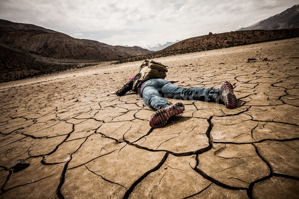 person lays on the dried ground Stock photo © cookelma