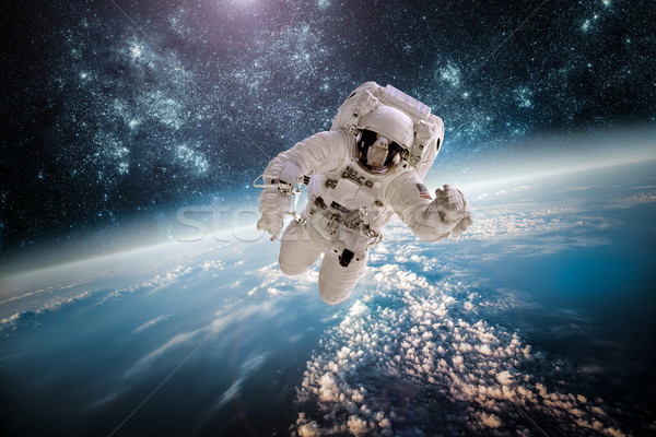 астронавт космическое пространство фон планете Земля Элементы изображение Сток-фото © cookelma