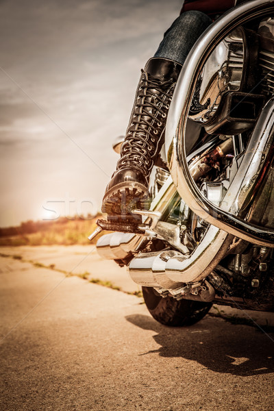 Stock photo: Biker girl riding on a motorcycle