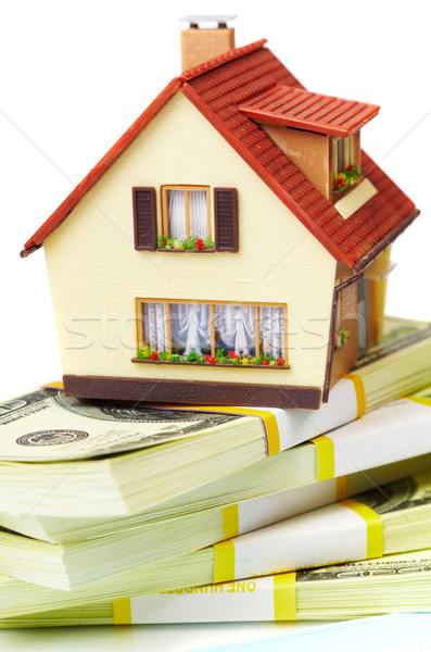 Stock photo: house on packs of banknotes