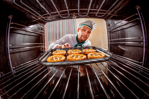 Chef cooking in the oven. Stock photo © cookelma