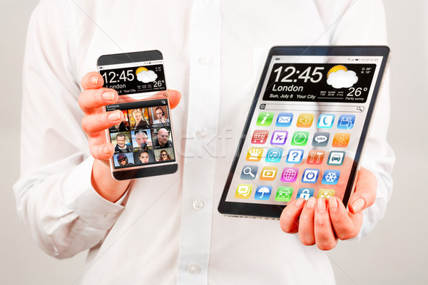 Stockfoto: Smartphone · tablet · transparant · scherm · menselijke · handen