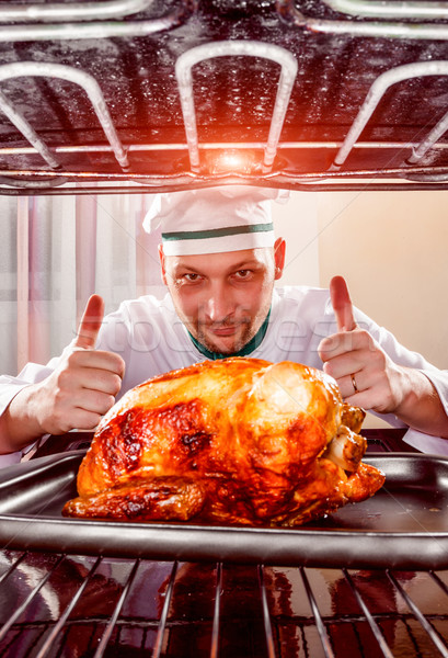 Cooking chicken in the oven. Stock photo © cookelma