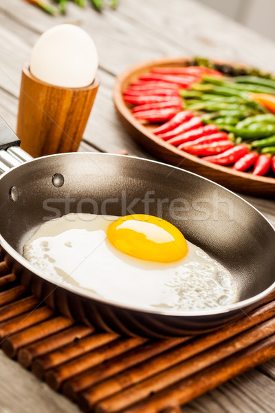 Sült tojások fa asztal reggeli étel konyha Stock fotó © cookelma
